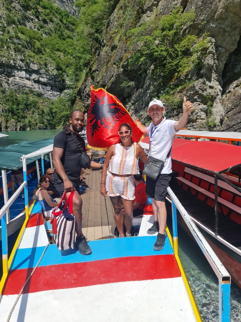 Mariel Tours boat travelling through the turquoise waters of Shala River